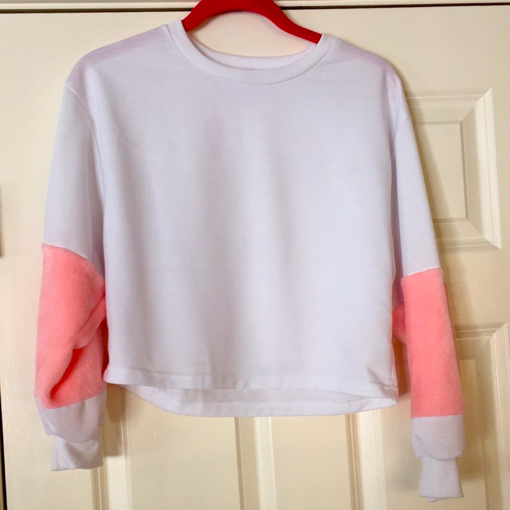 White sweatshirt with pink fur sleeves